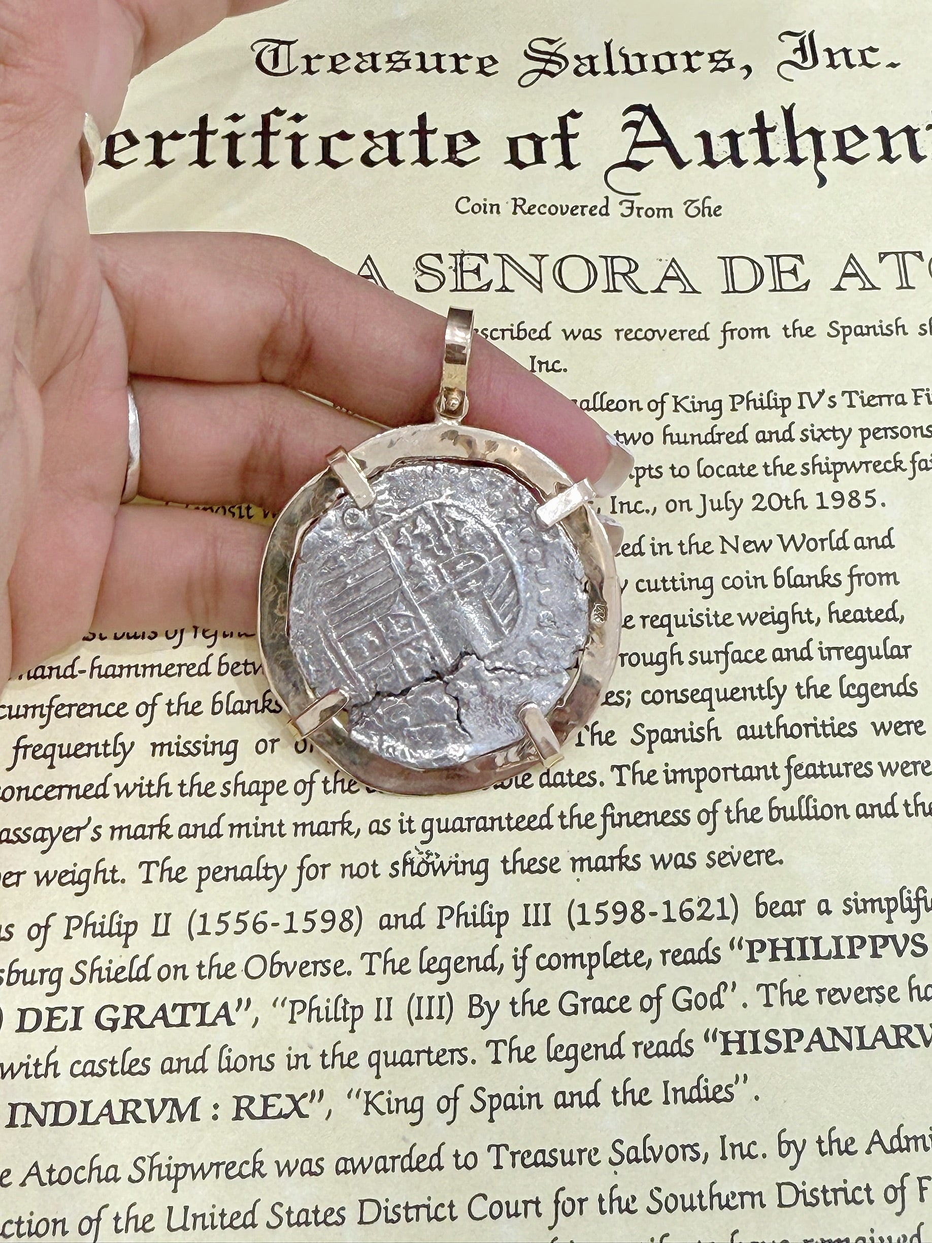 ACTUAL COIN NUESTRA SENORA DE ATOCHA SILVER COIN 8 REALE GRADE 1 COIN NO 85A-157139 DATED ##21 BEZELED WITH 14k SOLID GOLD