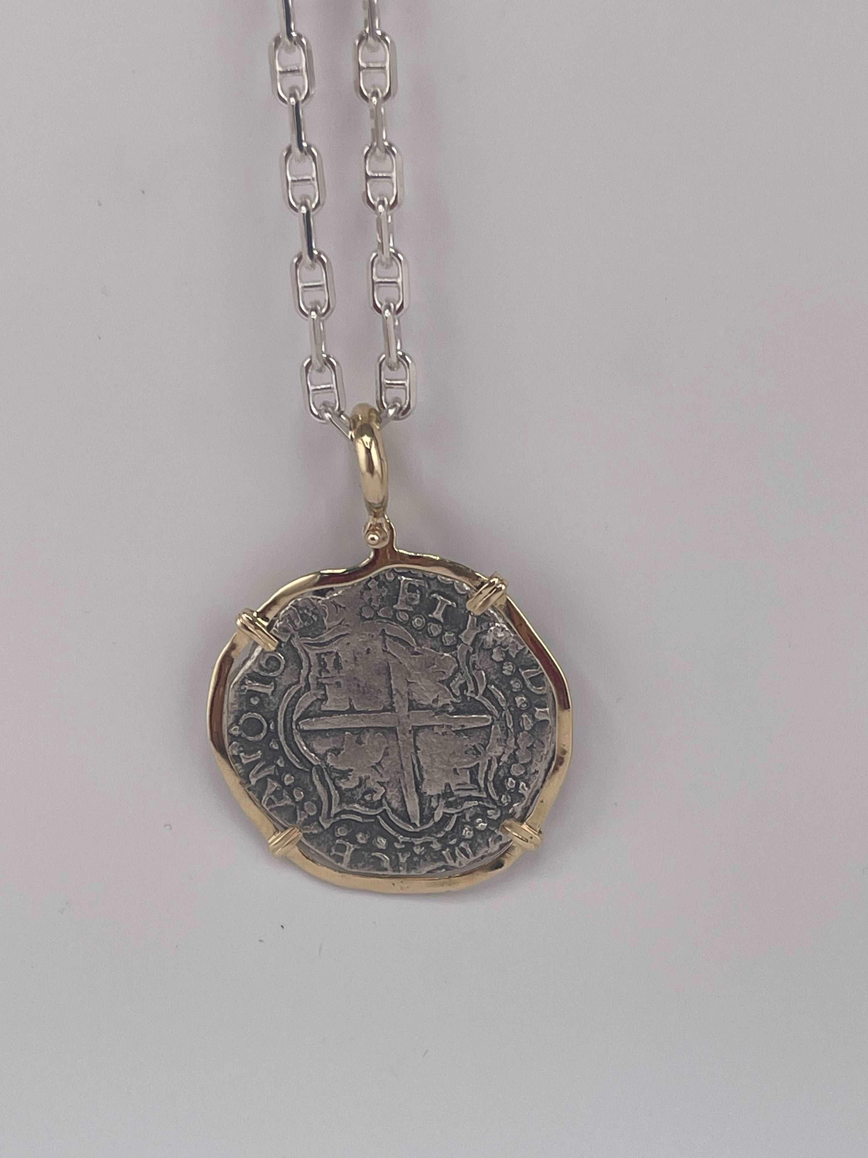 NUESTRA SENORA DE ATOCHA SOLID LARGE SIZE SILVER COIN PENDANT IN 14KT SOLID GOLD BEZEL
