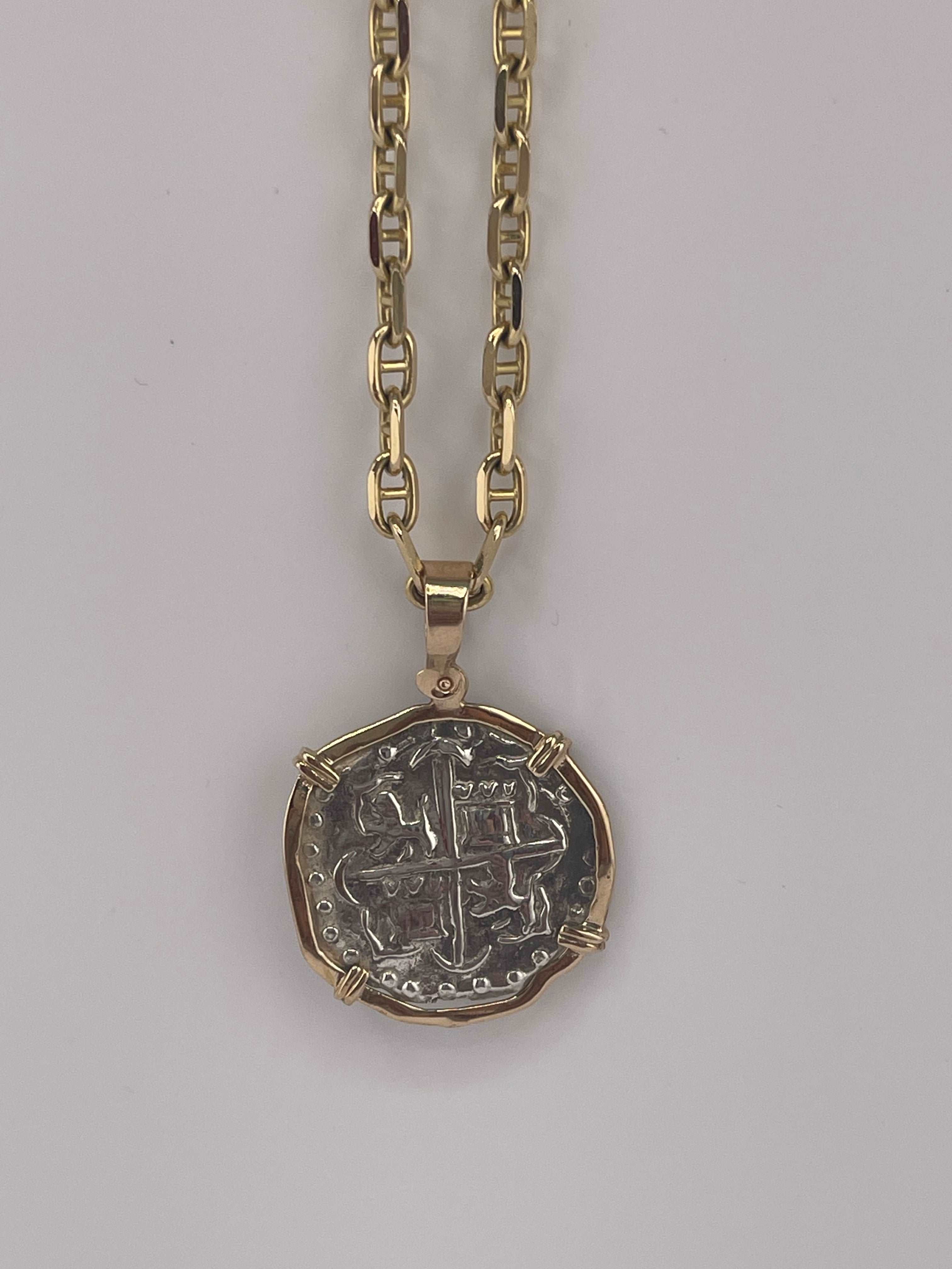 NUESTRA SENORA DE ATOCHA SOLID SILVER COIN PENDANT IN 14KT SOLID GOLD BEZEL
