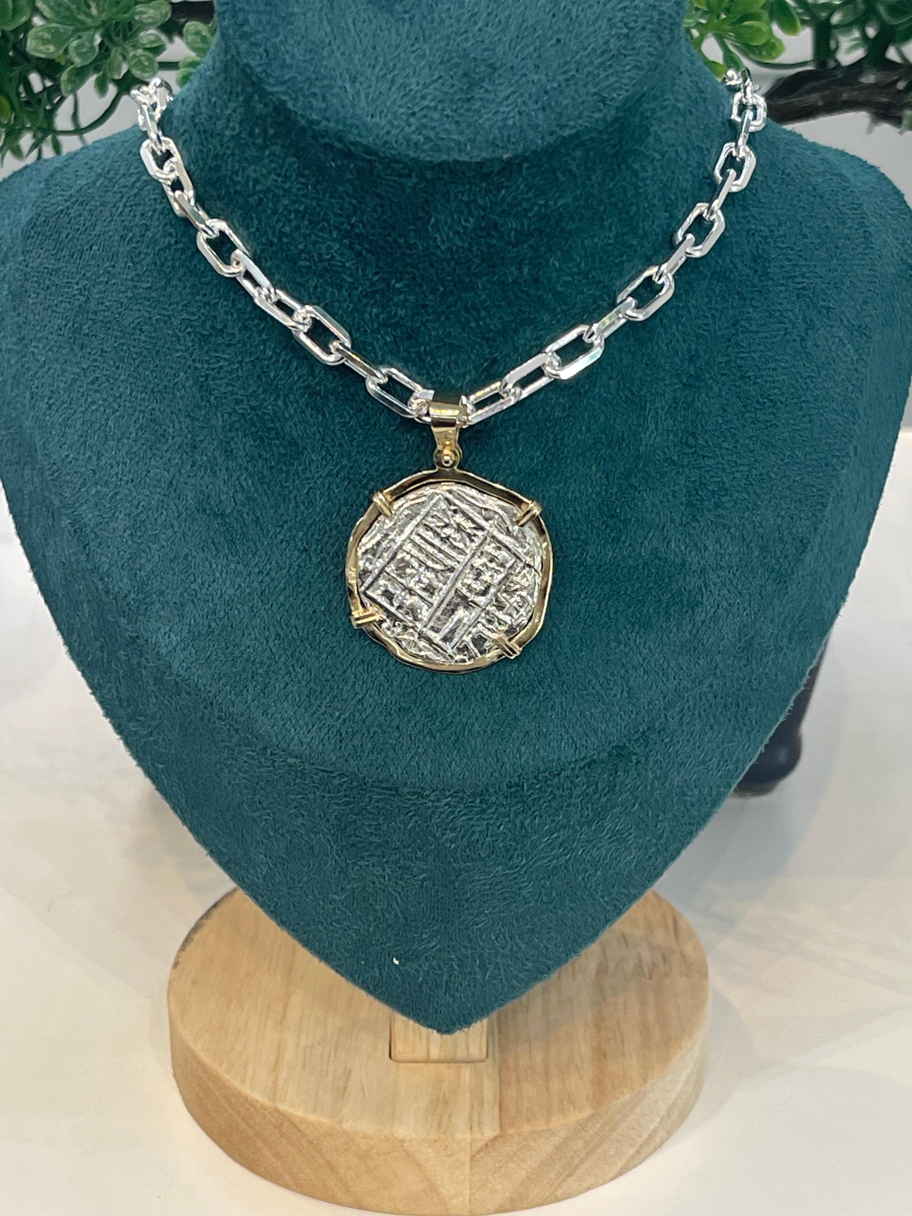 NUESTRA SENORA DE ATOCHA SOLID SILVER COIN PENDANT IN 14KT SOLID GOLD BEZEL