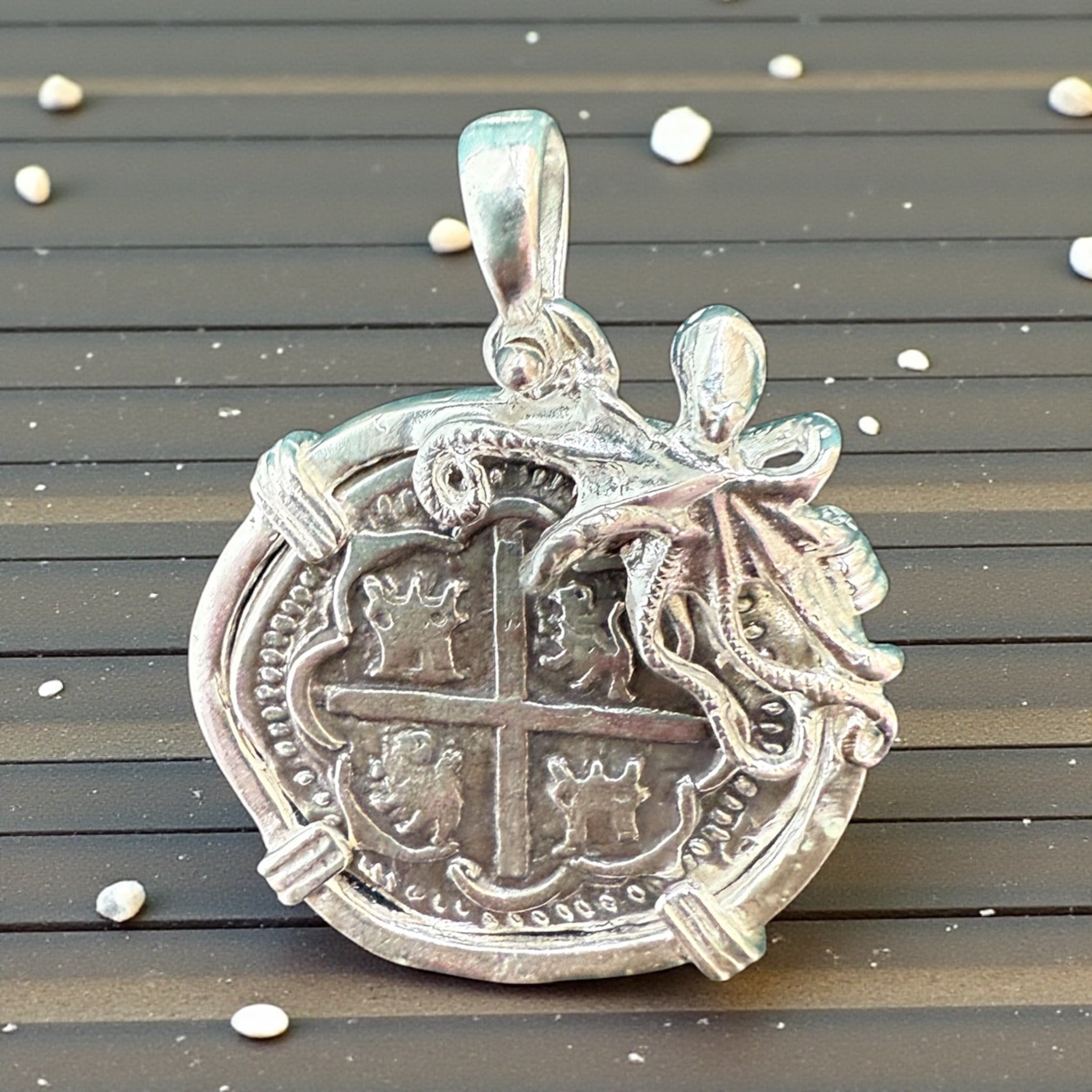ATOCHA SOLID SILVER COIN PENDANT IN BEAUTIFUL OCTOPUS BEZEL