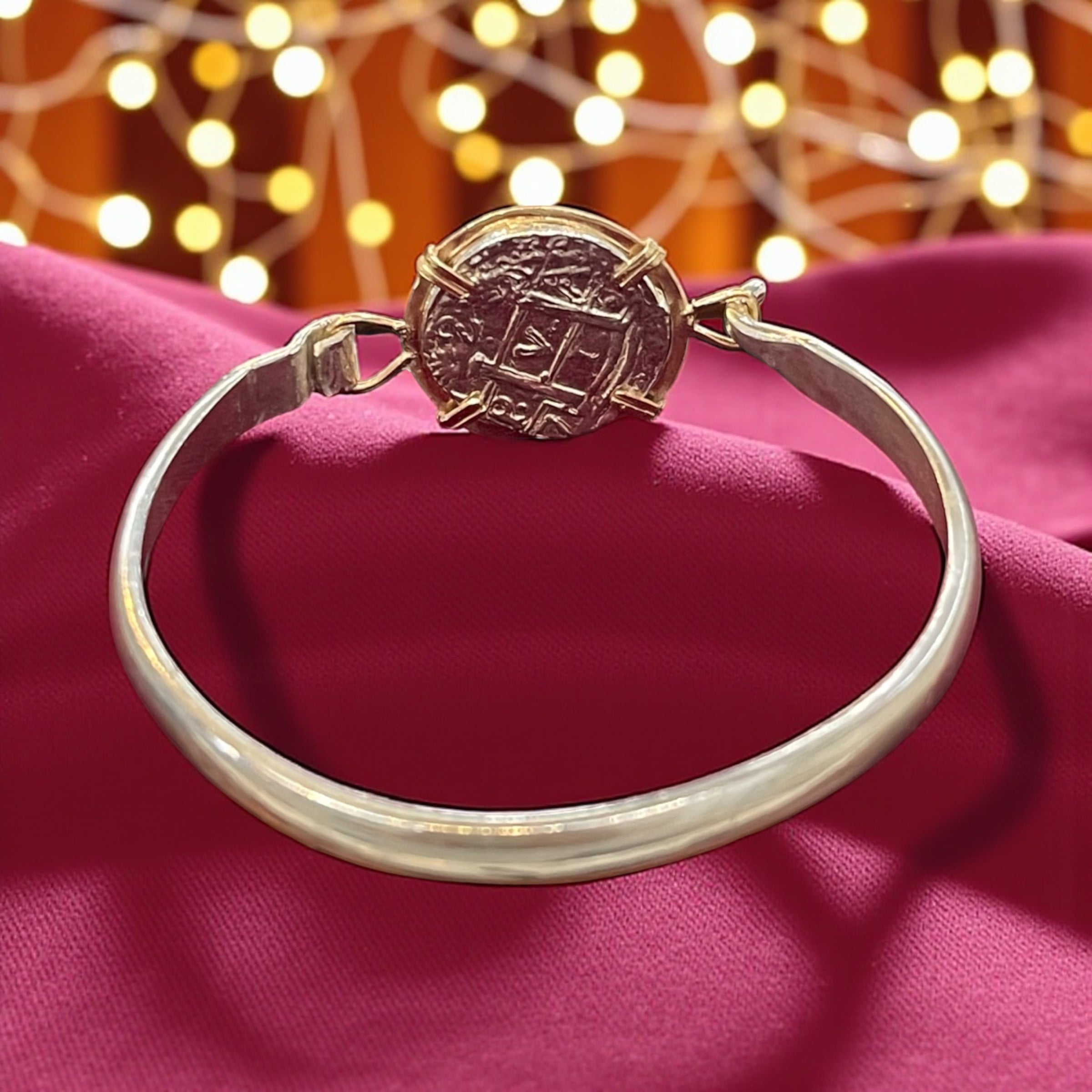 ATOCHA SOLID SILVER COIN BANGLE BEZELED WITH 14k SOLID GOLD BEZEL
