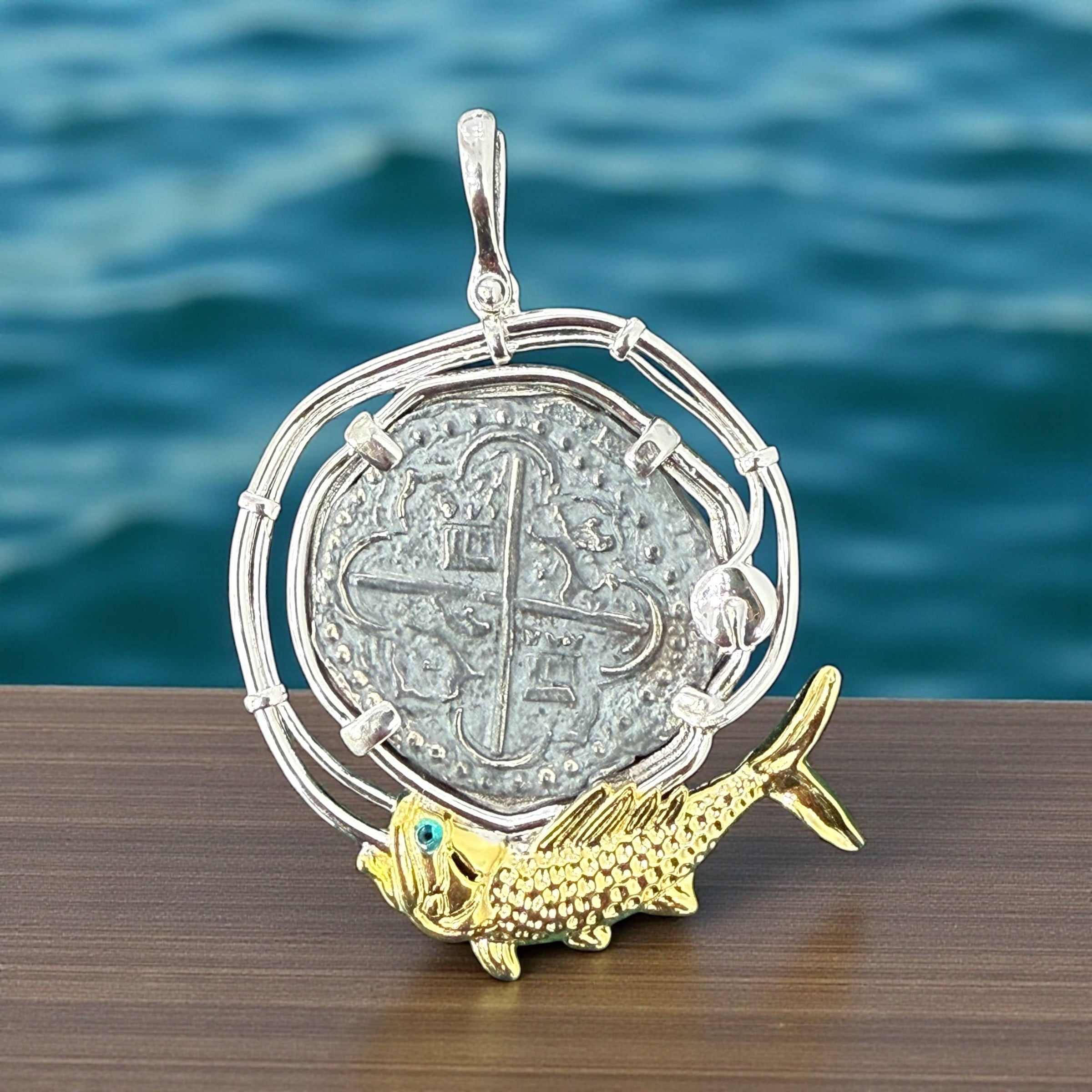 Atocha large size silver coin pendant in beautiful hook rope bezel and 14k gold vermeil fish setting on bottom in green crystal eye
