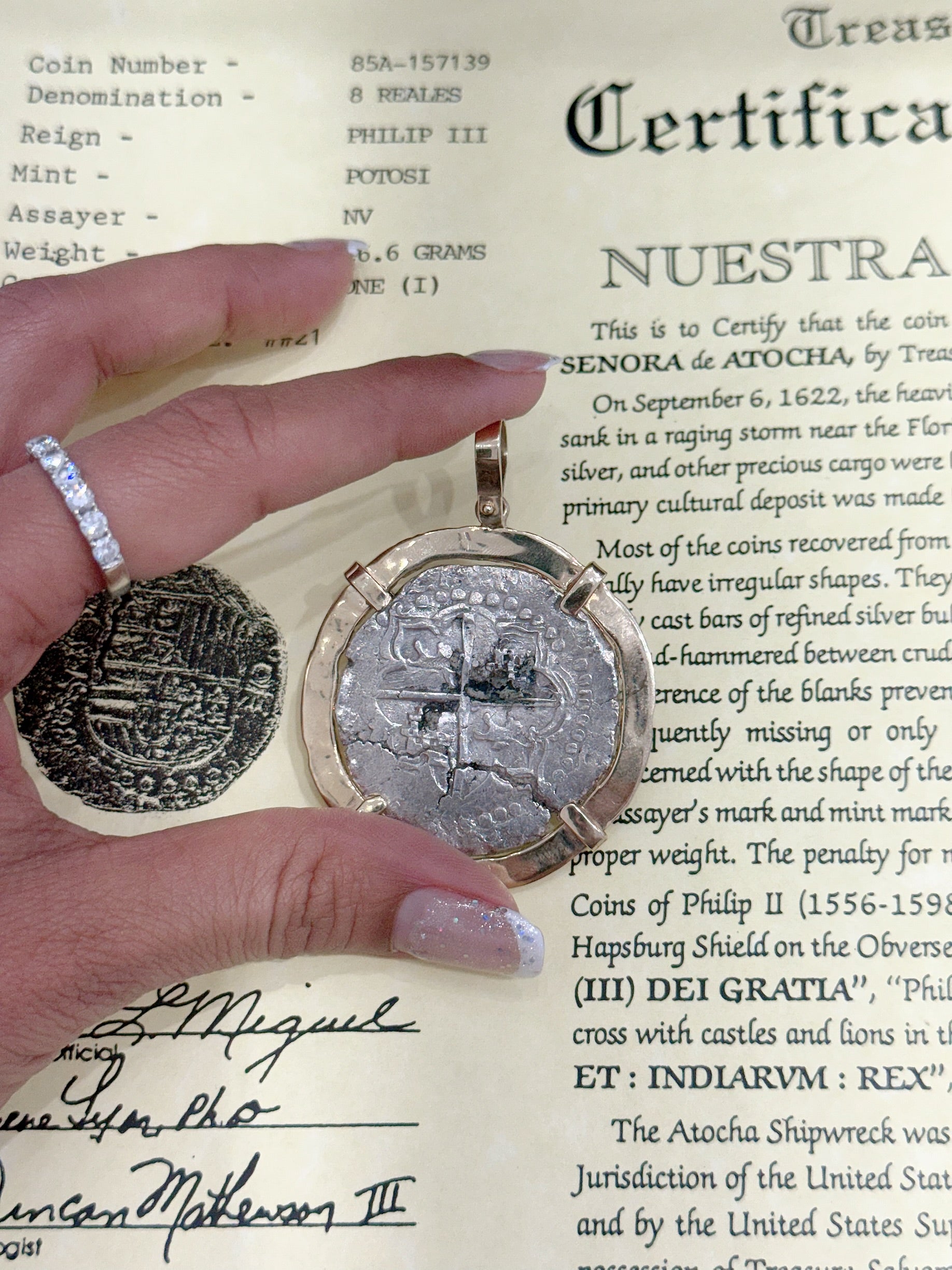 ACTUAL COIN NUESTRA SENORA DE ATOCHA SILVER COIN 8 REALE GRADE 1 COIN NO 85A-157139 DATED ##21 BEZELED WITH 14k SOLID GOLD