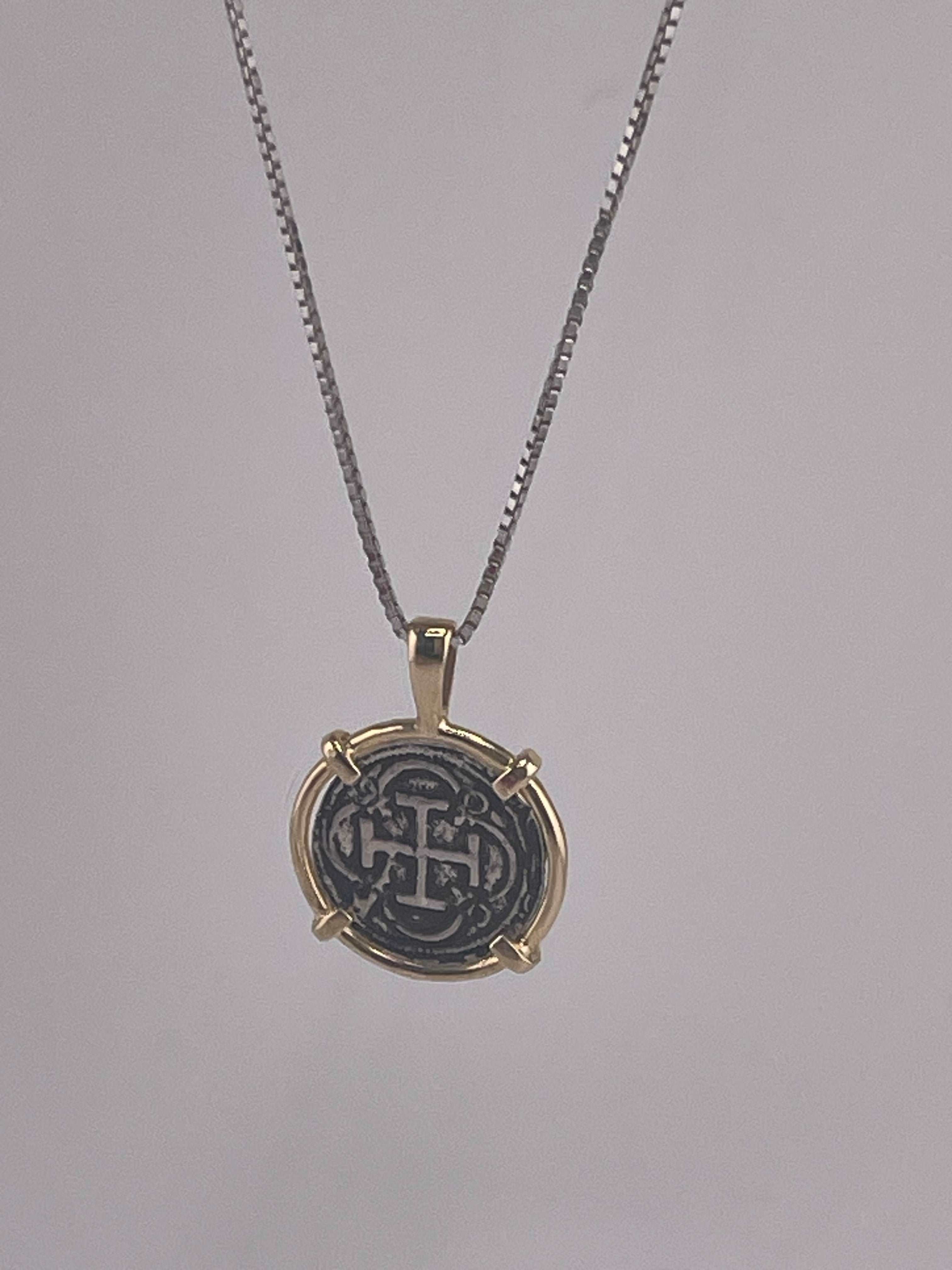 NUESTRA SENORA DE ATOCHA SILVER COIN PENDANT IN 14KT GOLD BEZEL