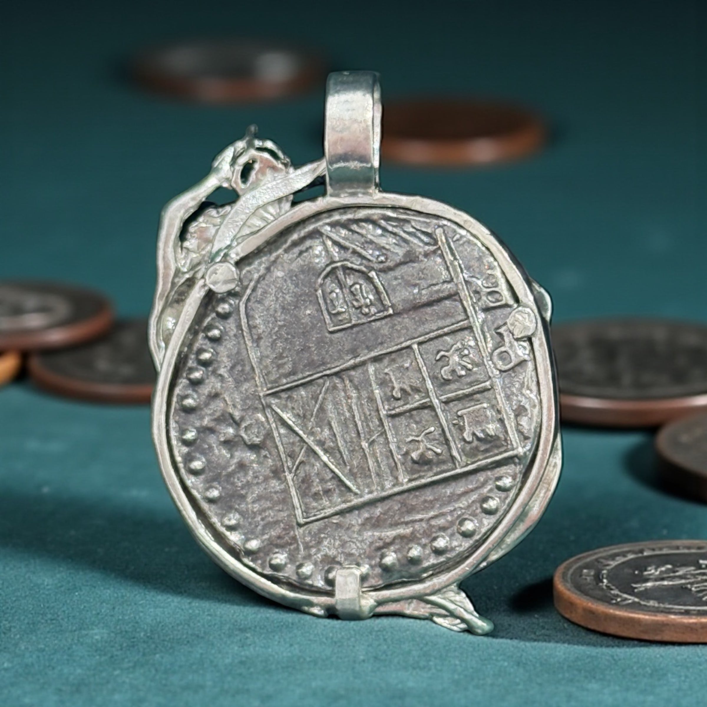 Atocha shipwreck silver coin pendant in mermaid bezel holding emerald