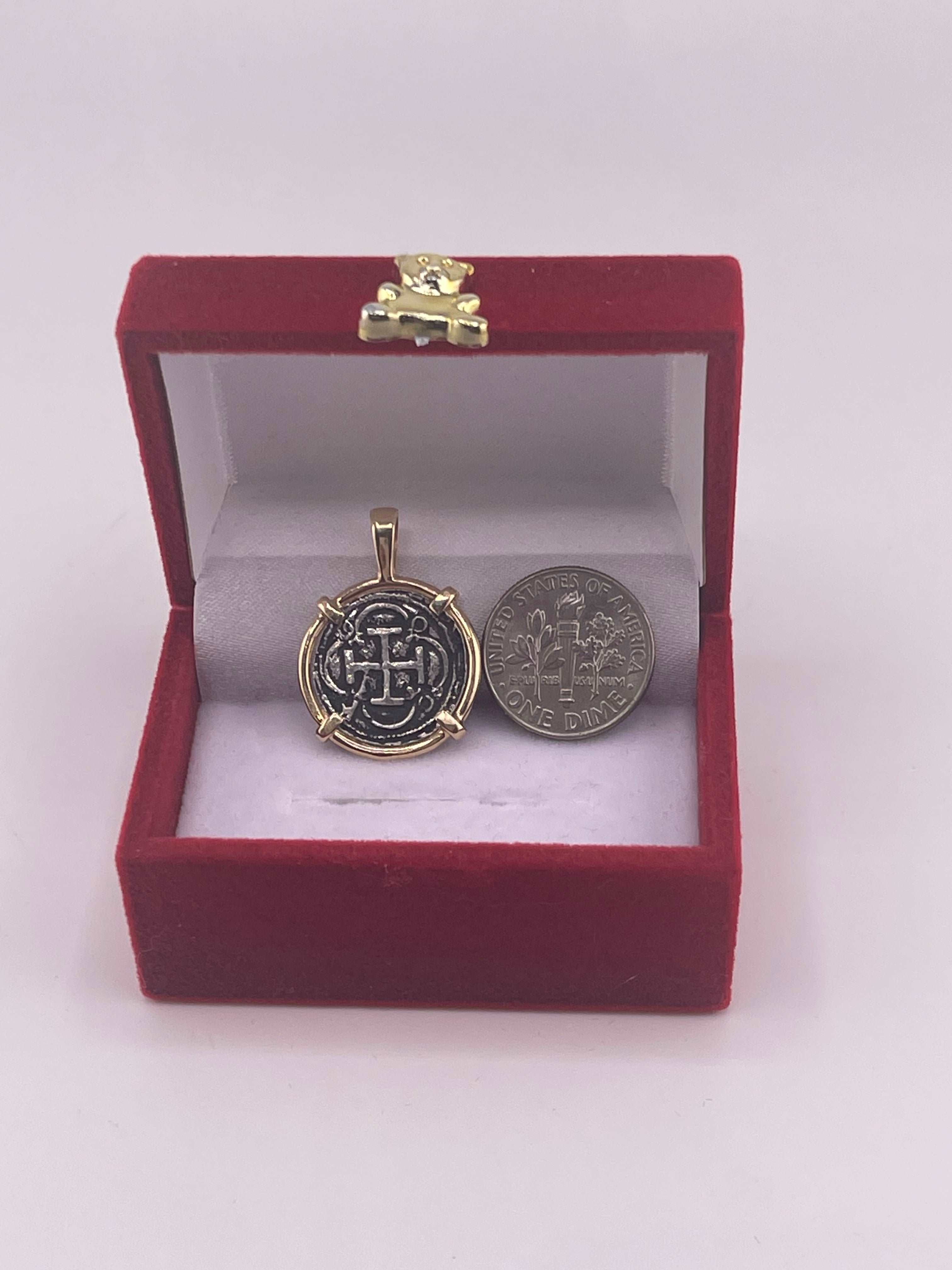 NUESTRA SENORA DE ATOCHA SILVER COIN PENDANT IN 14KT GOLD BEZEL