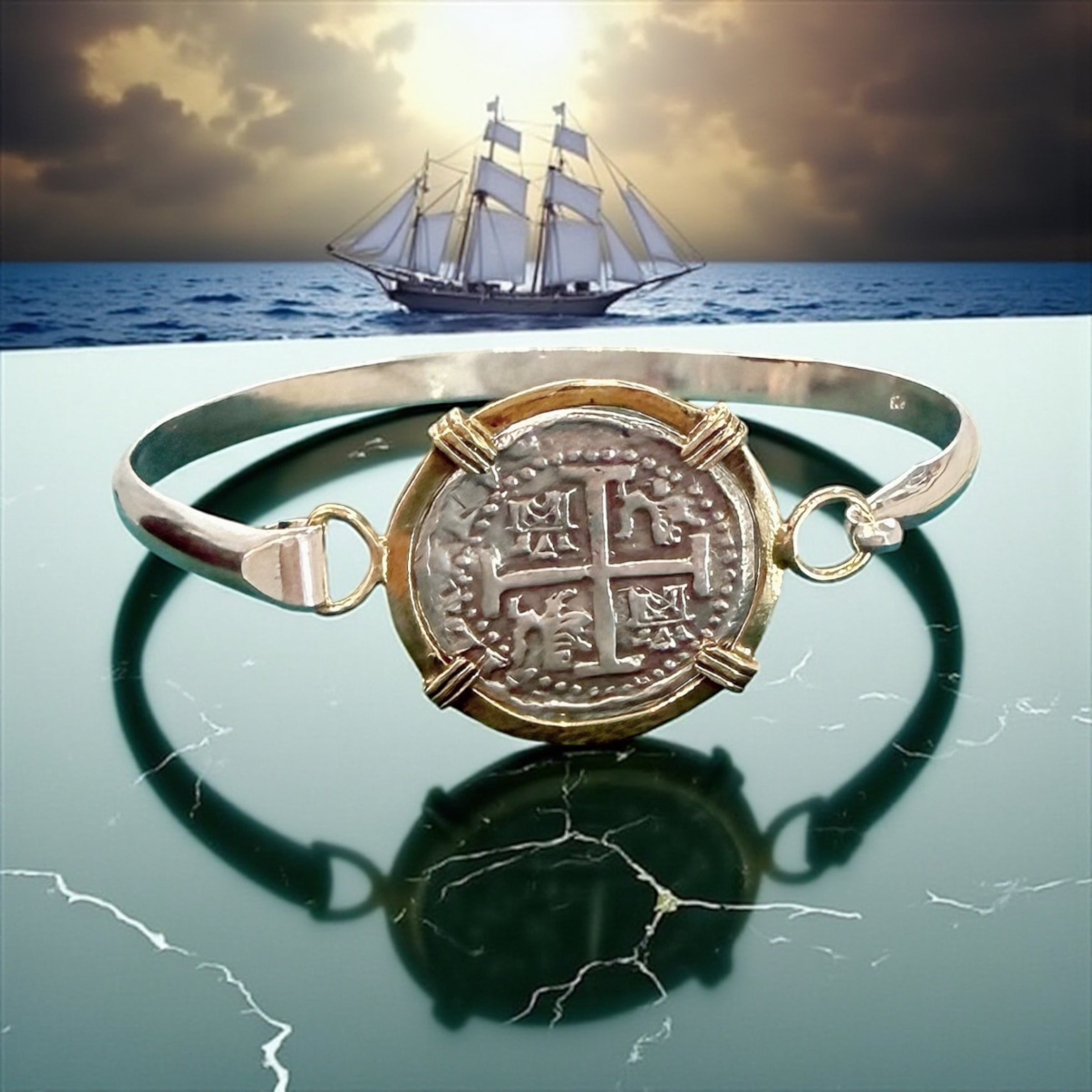 ATOCHA SOLID SILVER COIN BANGLE BEZELED WITH 14k SOLID GOLD BEZEL