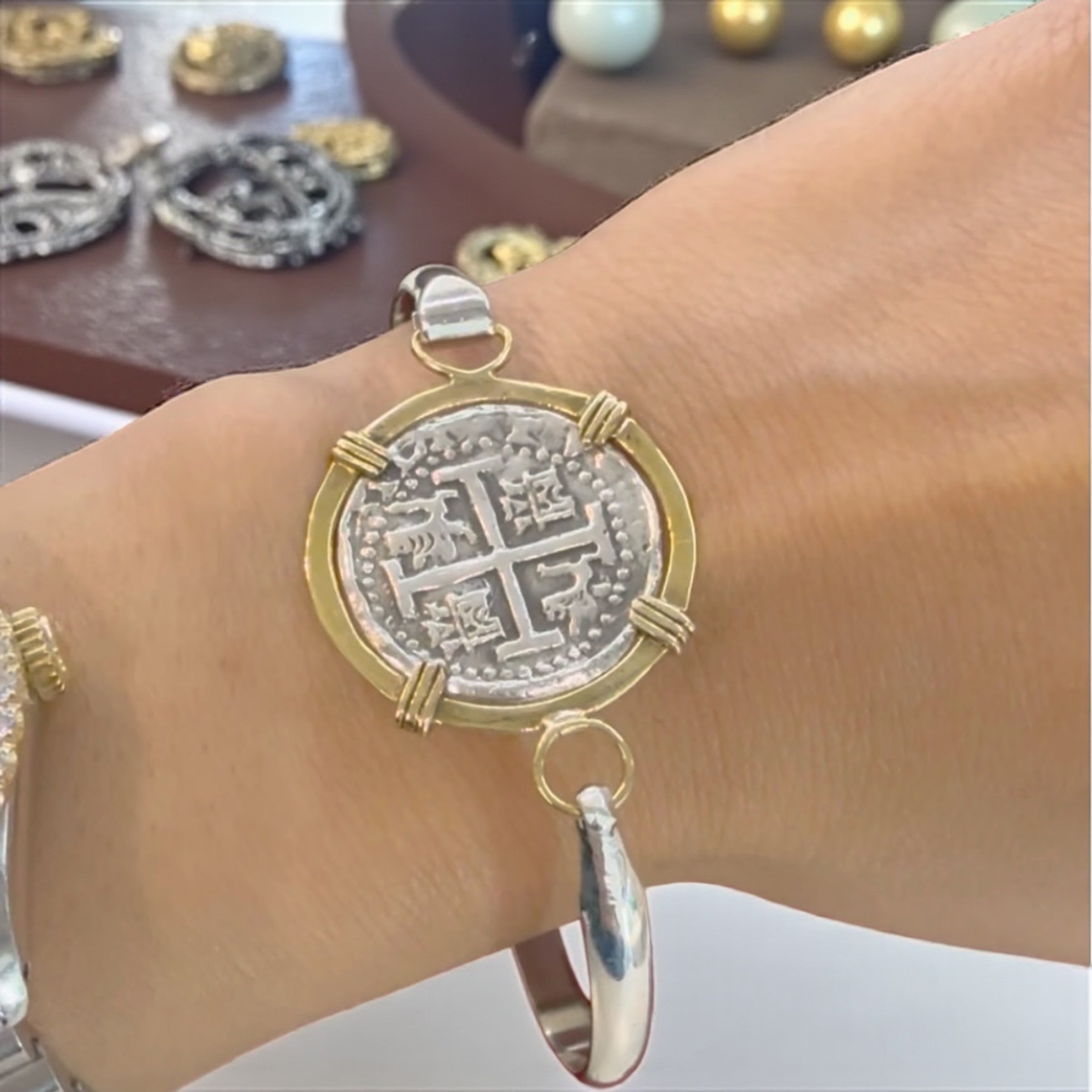 ATOCHA SOLID SILVER COIN BANGLE BEZELED WITH 14k SOLID GOLD BEZEL