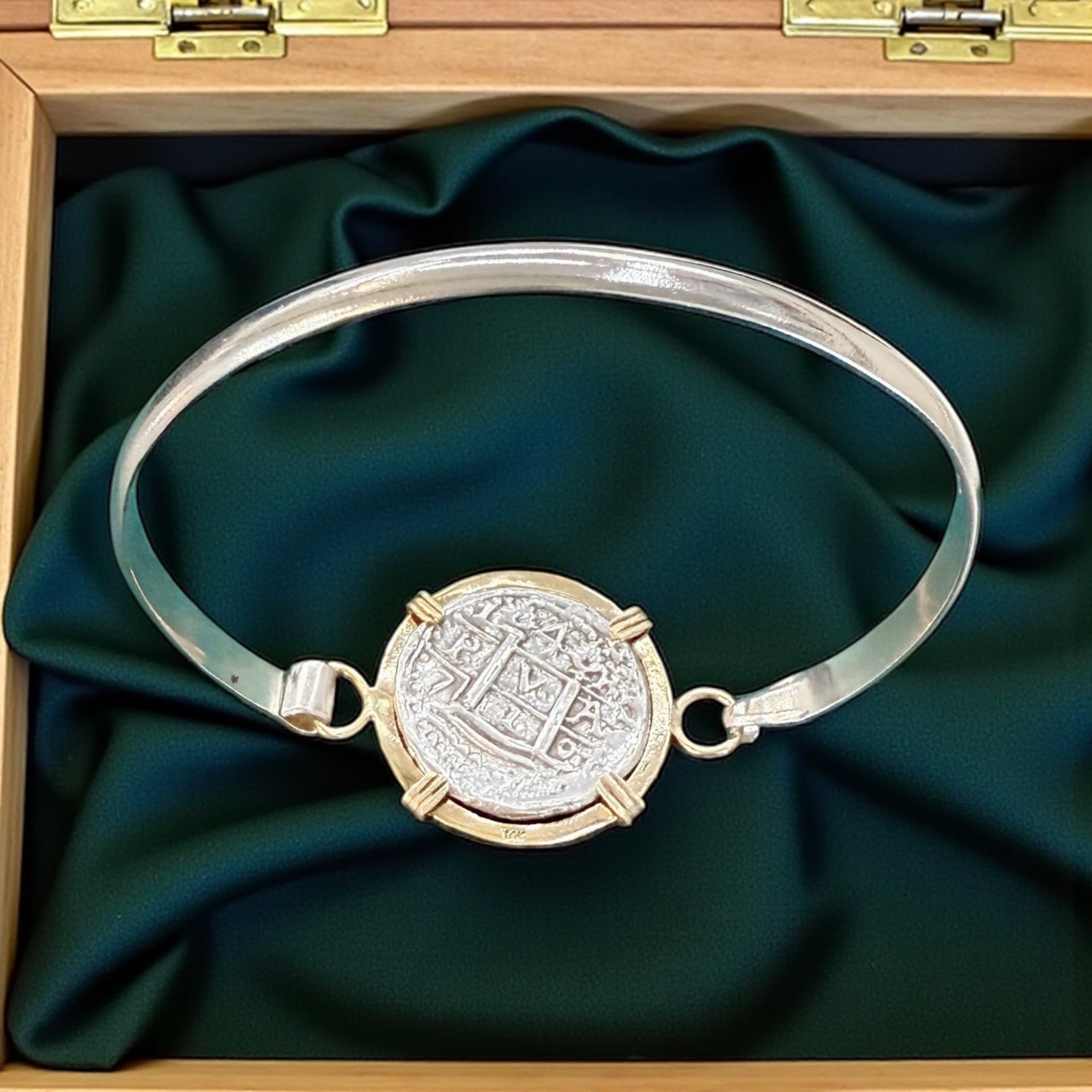 ATOCHA SOLID SILVER COIN BANGLE BEZELED WITH 14k SOLID GOLD BEZEL