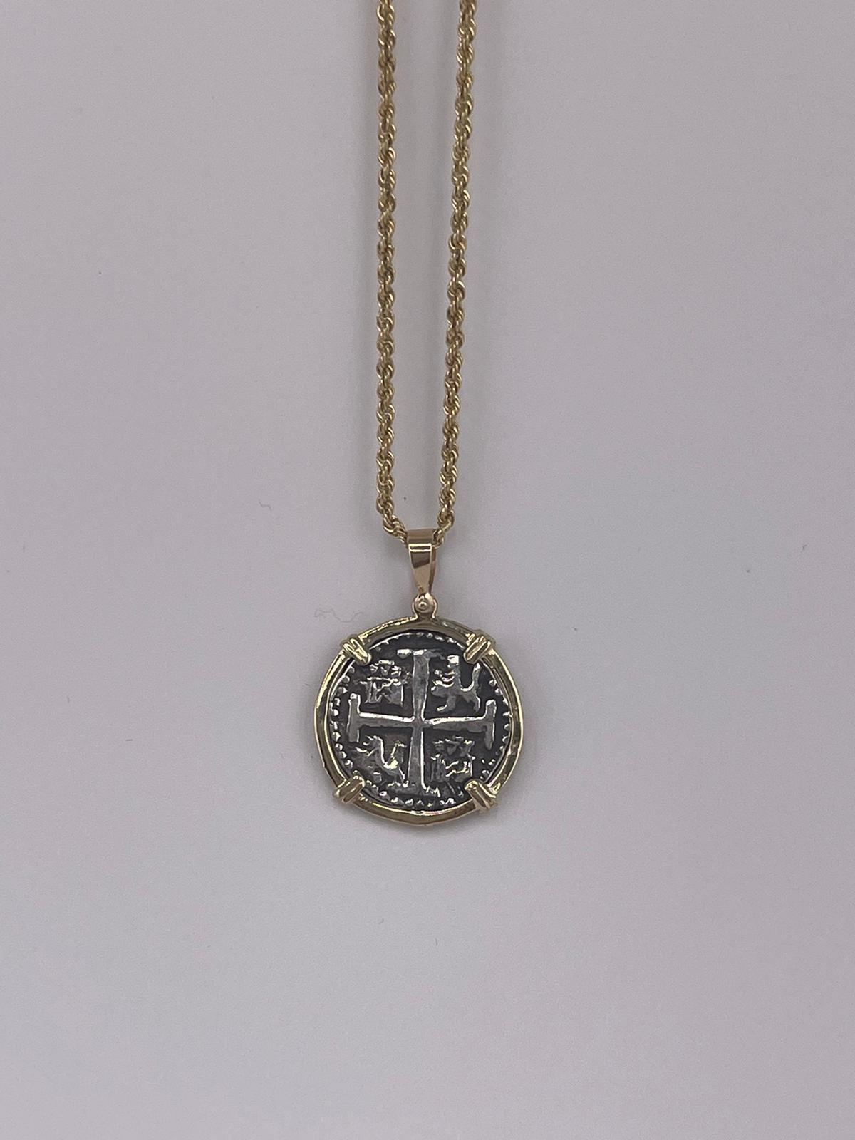 NUESTRA SENORA DE ATOCHA SILVER COIN PENDANT IN 14KT GOLD BEZEL
