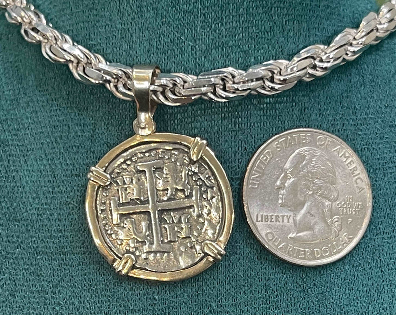 NUESTRA SENORA DE ATOCHA  SILVER COIN PENDANT IN 14KT GOLD BEZEL