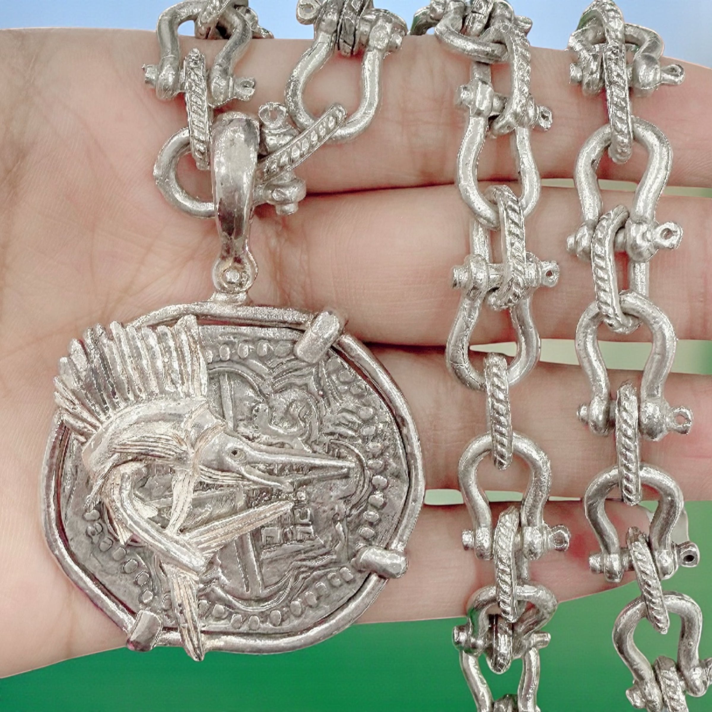 ATOCHA LARGE SILVER COIN PENDANT IN FISH BEZEL