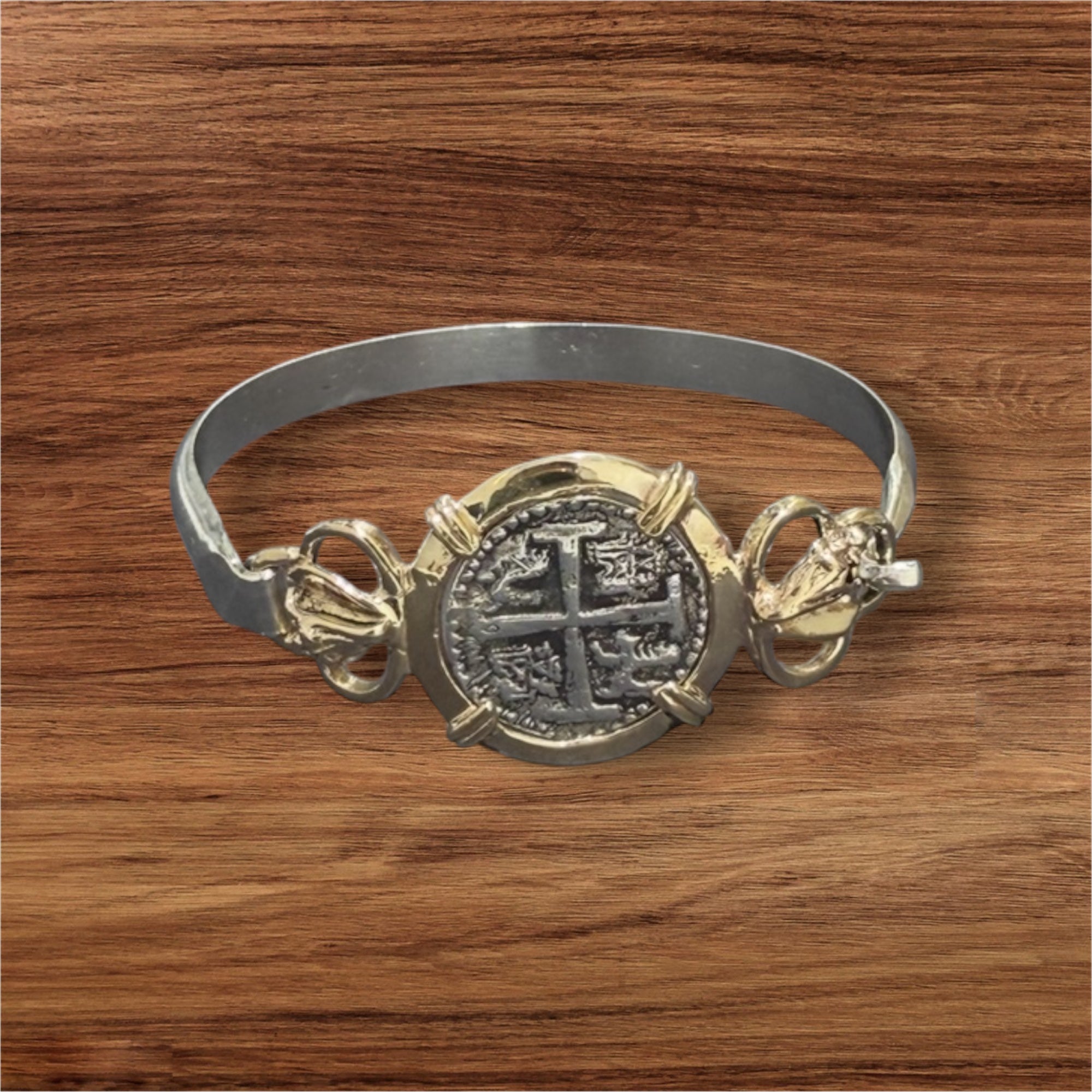 ATOCHA SOLID SILVER COIN BANGLE BEZELED WITH 14k SOLID GOLD BEZEL AND 14k SOLID GOLD CONCHS