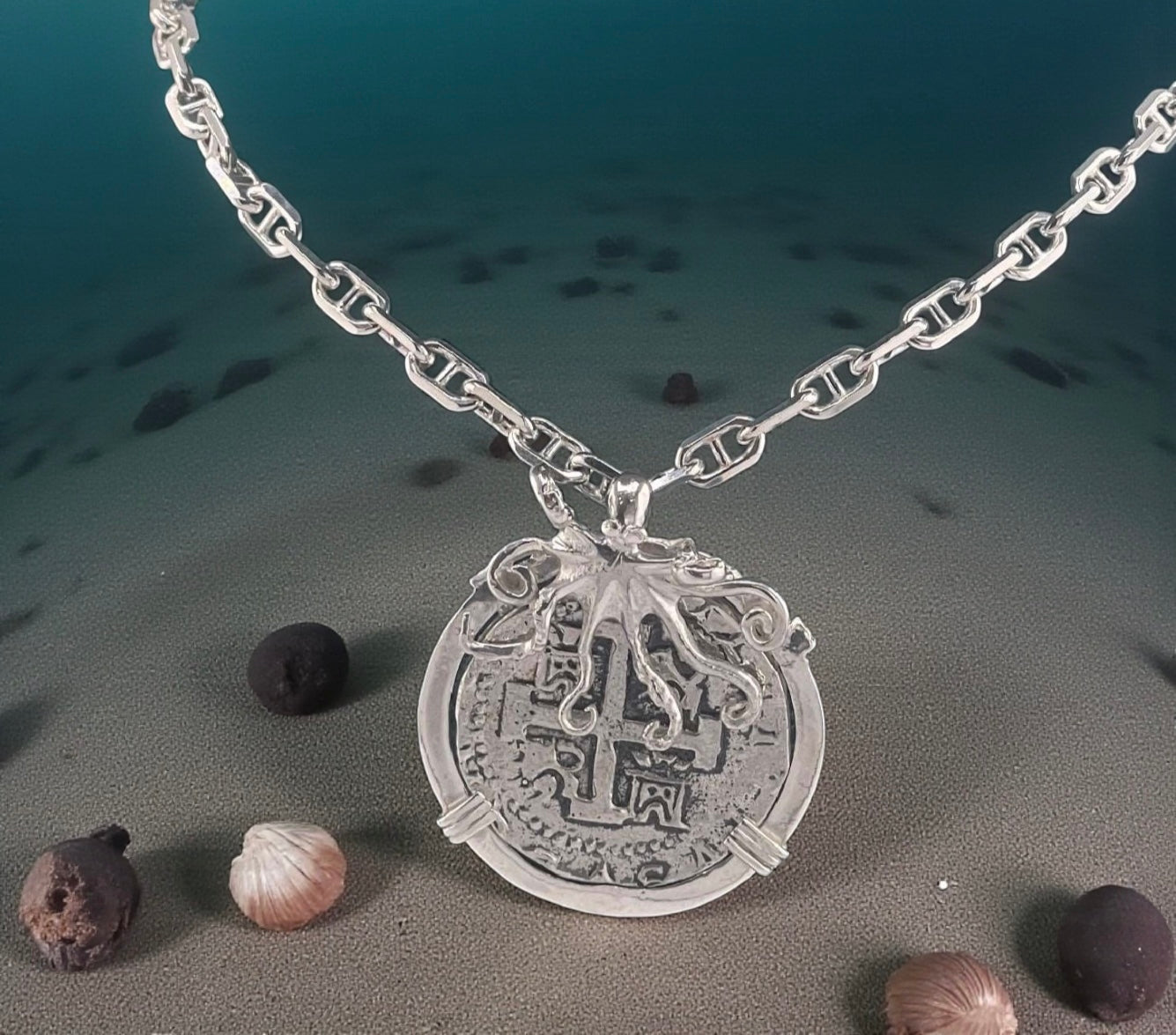 ATOCHA SOLID SILVER COIN PENDANT IN BEAUTIFUL OCTOPUS BEZEL
