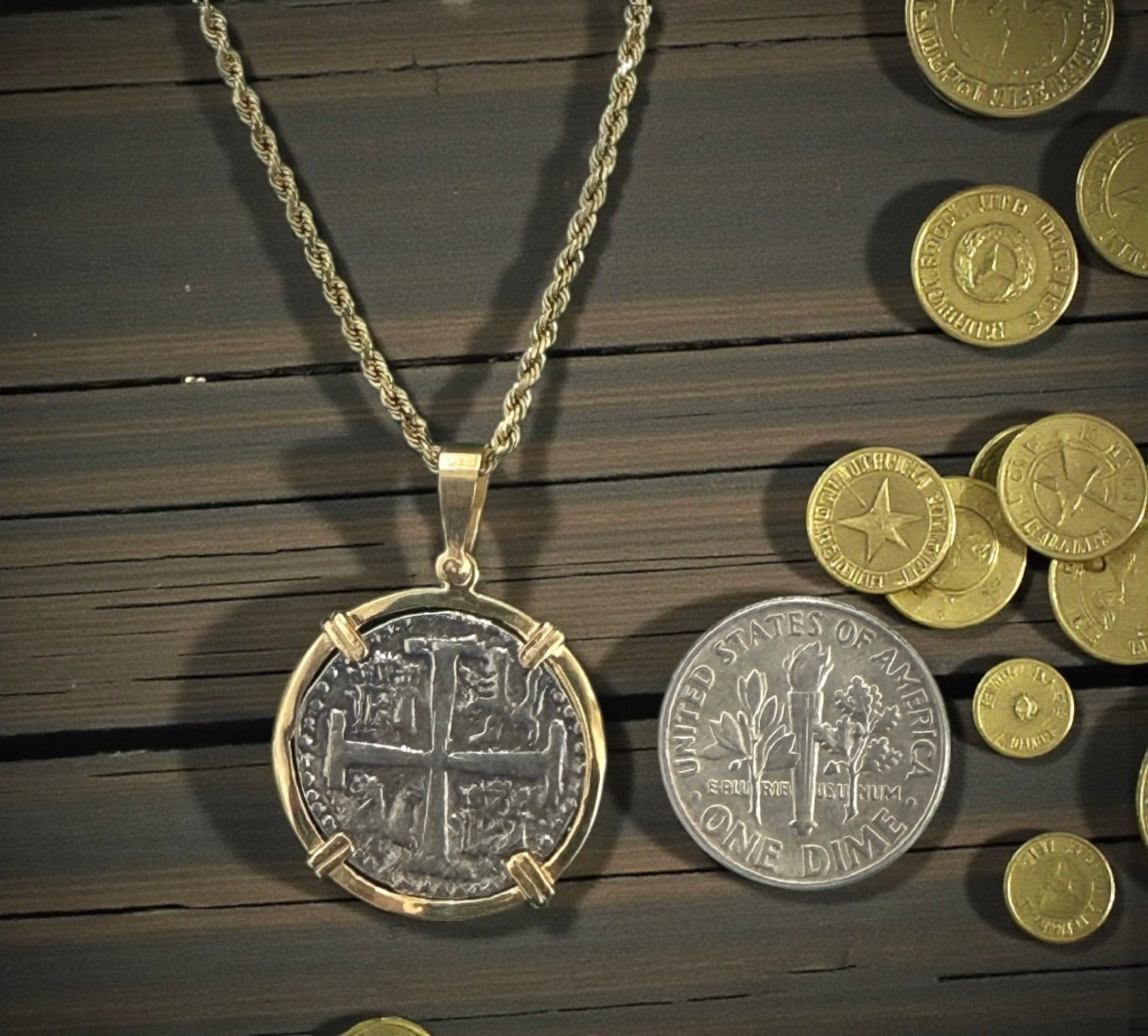 NUESTRA SENORA DE ATOCHA SILVER COIN PENDANT IN 14KT GOLD BEZEL