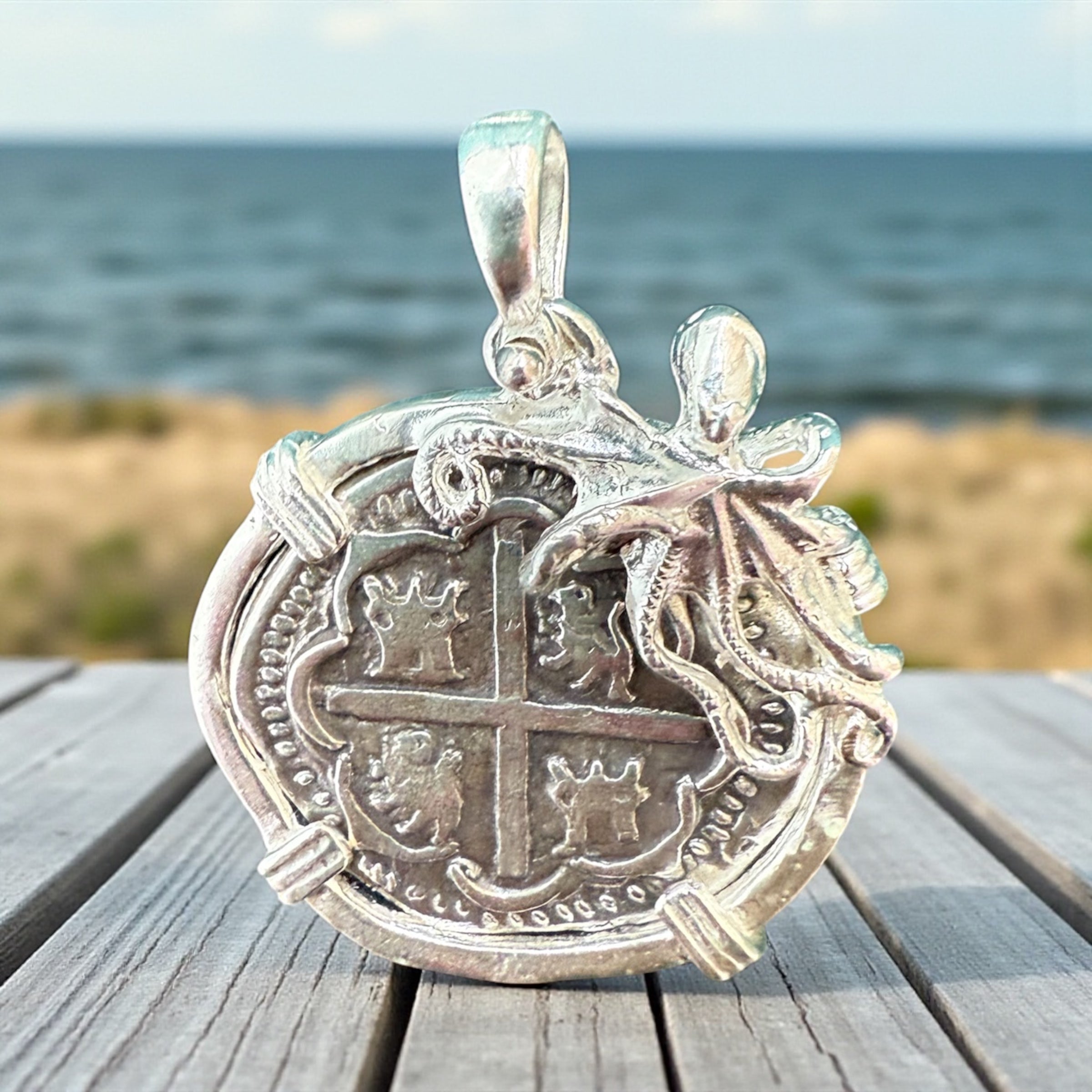 ATOCHA SOLID SILVER COIN PENDANT IN BEAUTIFUL OCTOPUS BEZEL