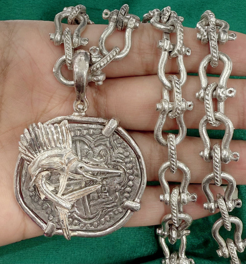 ATOCHA LARGE SILVER COIN PENDANT IN FISH BEZEL