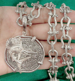 ATOCHA LARGE SILVER COIN PENDANT IN FISH BEZEL