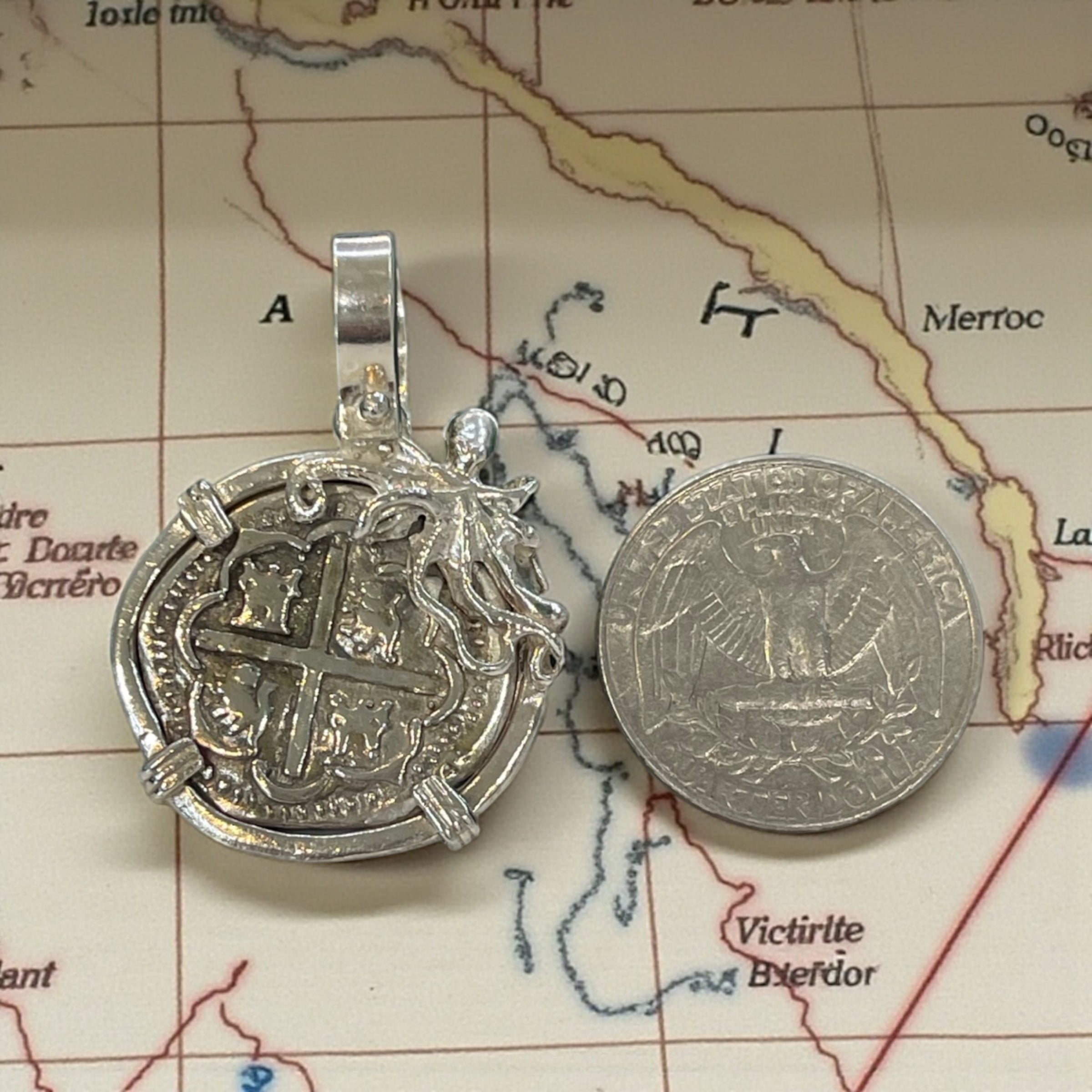 ATOCHA SOLID SILVER COIN PENDANT IN BEAUTIFUL OCTOPUS BEZEL