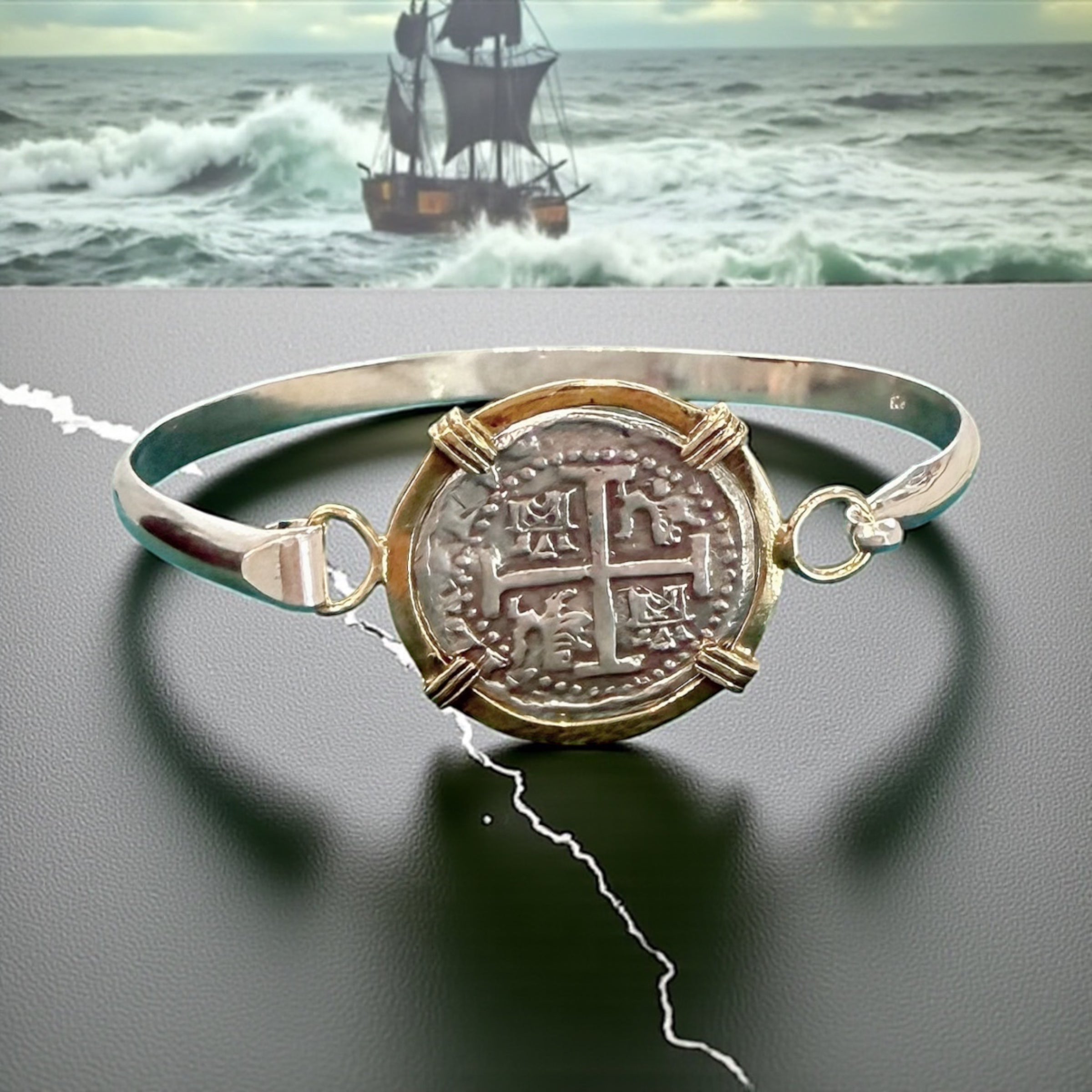 ATOCHA SOLID SILVER COIN BANGLE BEZELED WITH 14k SOLID GOLD BEZEL